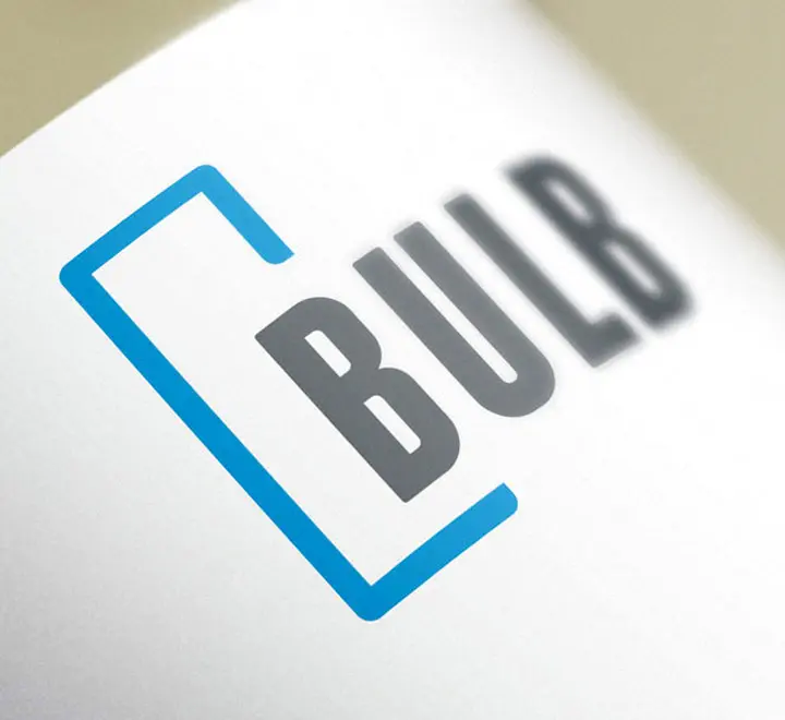 Bulb company logo with blue bracket and bold gray text on white surface